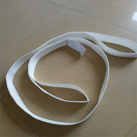 One way lifting sling band with a formed flat eye at each end and a printed label sewn into the face of the band