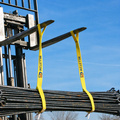 A yard lift of steel rod bundles with the slings gathered at the hook, showing the spacing and hook angle a pre-slu
ng drawing has to reproduce